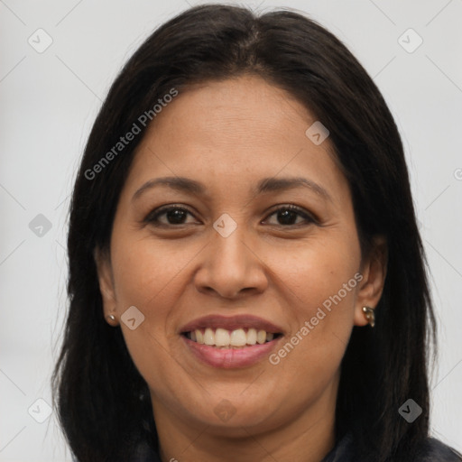 Joyful latino young-adult female with long  brown hair and brown eyes