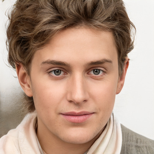 Joyful white young-adult male with medium  brown hair and grey eyes