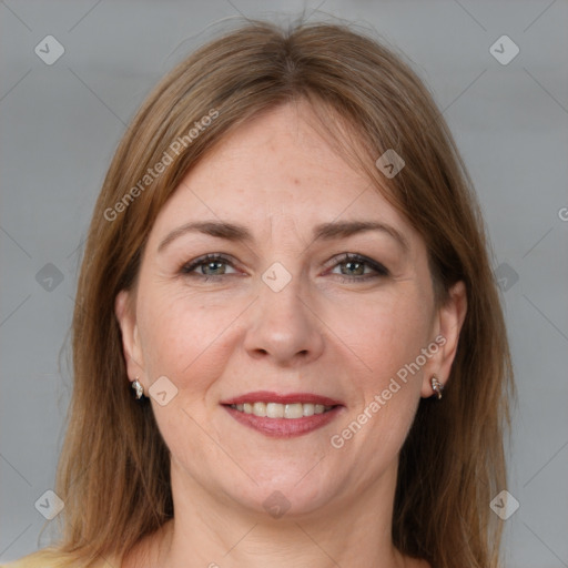 Joyful white adult female with medium  brown hair and grey eyes