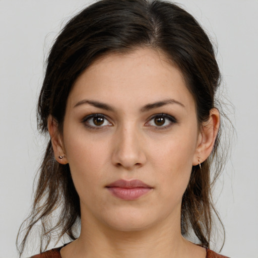 Neutral white young-adult female with medium  brown hair and brown eyes