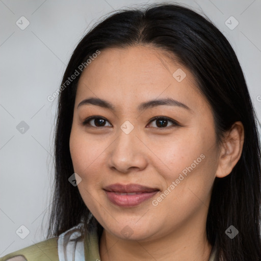 Joyful latino young-adult female with long  brown hair and brown eyes