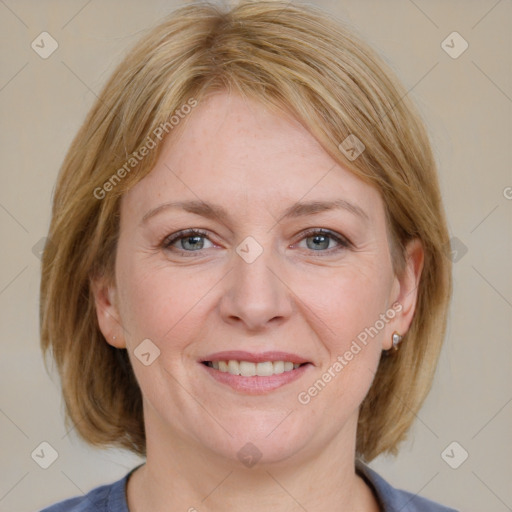 Joyful white adult female with medium  brown hair and blue eyes