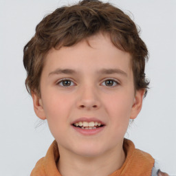 Joyful white child male with short  brown hair and brown eyes