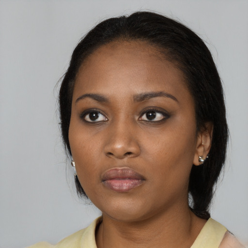 Neutral black young-adult female with medium  black hair and brown eyes