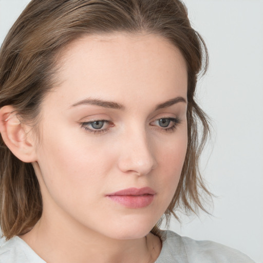 Neutral white young-adult female with medium  brown hair and blue eyes