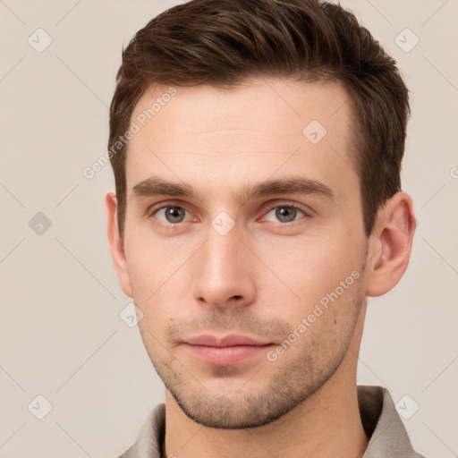 Neutral white young-adult male with short  brown hair and grey eyes