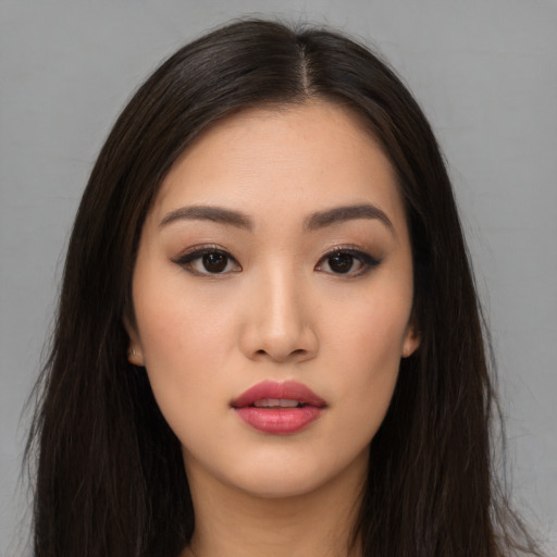 Neutral asian young-adult female with long  brown hair and brown eyes