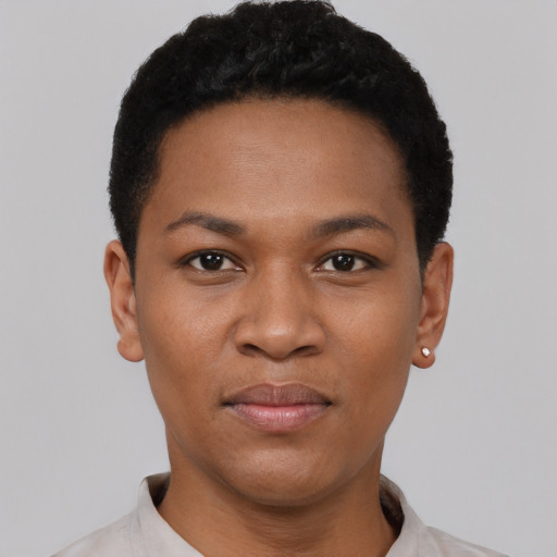 Joyful black young-adult female with short  black hair and brown eyes