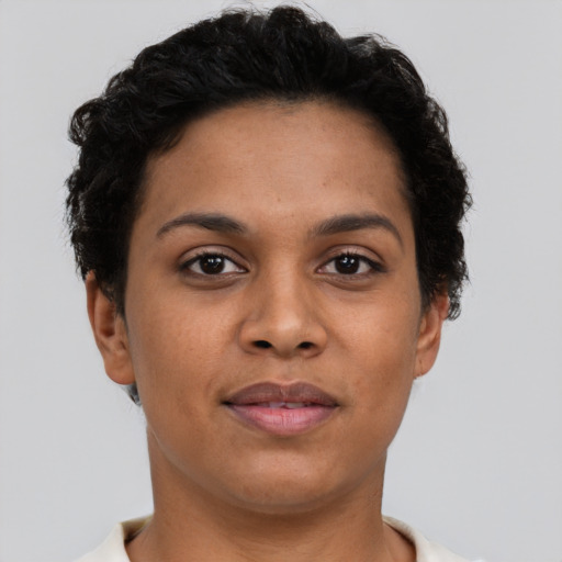 Joyful latino young-adult female with short  brown hair and brown eyes