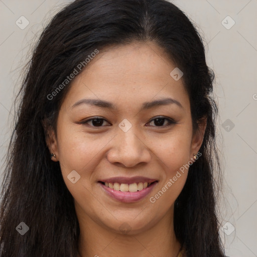 Joyful latino young-adult female with long  brown hair and brown eyes