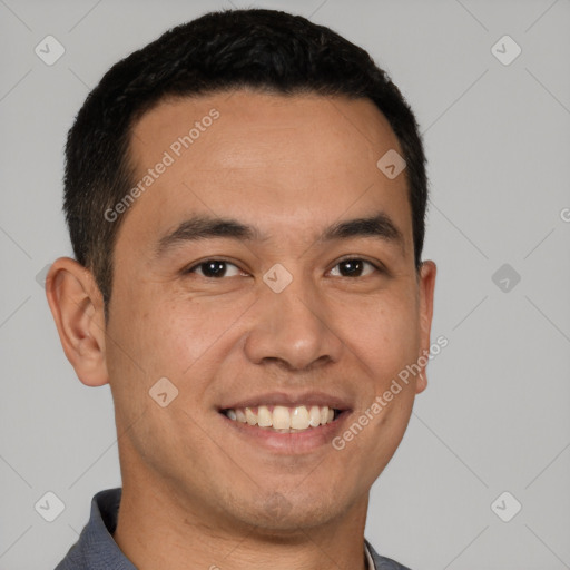 Joyful white young-adult male with short  black hair and brown eyes