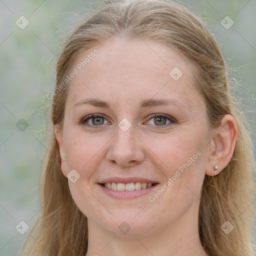 Joyful white young-adult female with long  brown hair and blue eyes