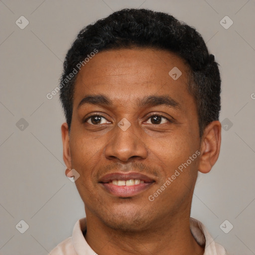 Joyful latino young-adult male with short  black hair and brown eyes