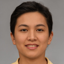 Joyful asian young-adult female with short  brown hair and brown eyes