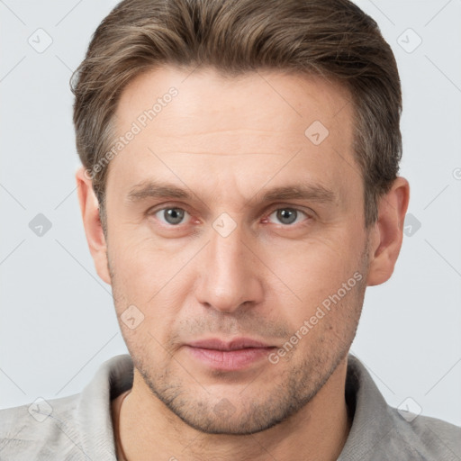 Joyful white adult male with short  brown hair and brown eyes