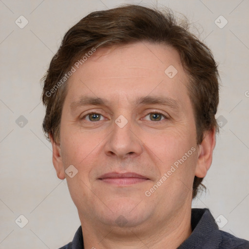 Joyful white adult male with short  brown hair and grey eyes