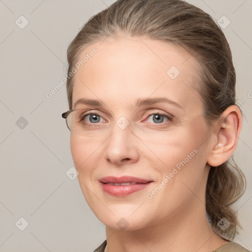 Joyful white adult female with medium  brown hair and grey eyes