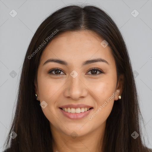 Joyful latino young-adult female with long  brown hair and brown eyes