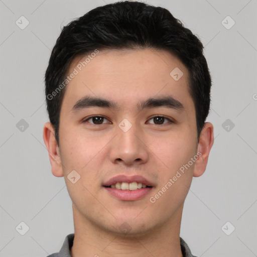 Joyful white young-adult male with short  black hair and brown eyes