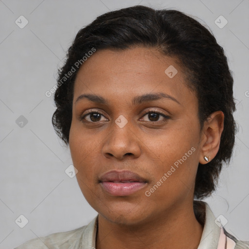 Joyful black young-adult female with medium  brown hair and brown eyes