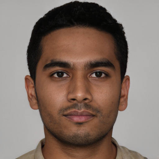 Neutral latino young-adult male with short  black hair and brown eyes