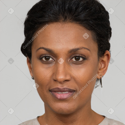 Joyful black young-adult female with short  brown hair and brown eyes