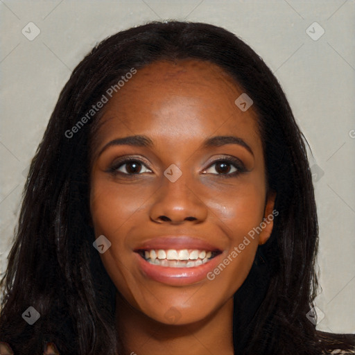 Joyful black young-adult female with long  black hair and brown eyes