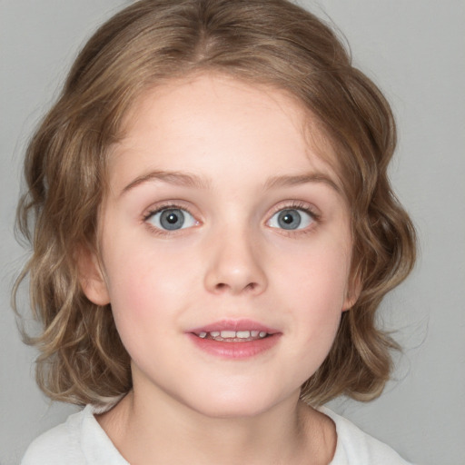 Joyful white child female with medium  brown hair and blue eyes