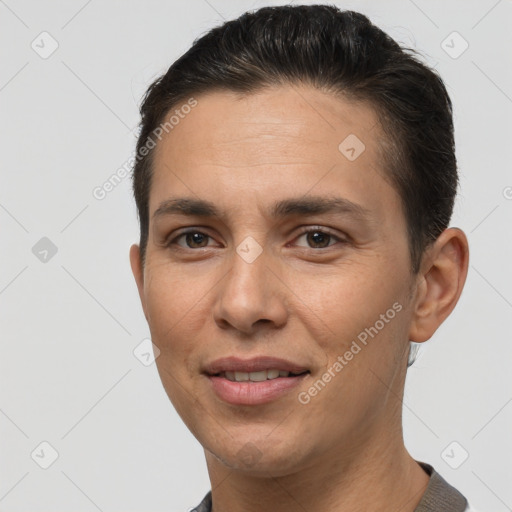 Joyful white adult male with short  brown hair and brown eyes