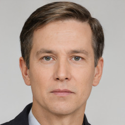 Neutral white adult male with short  brown hair and grey eyes