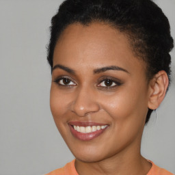 Joyful latino young-adult female with short  brown hair and brown eyes