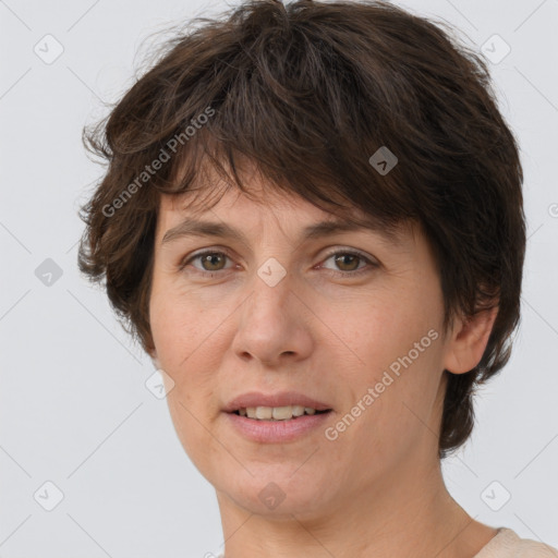 Joyful white adult female with short  brown hair and brown eyes