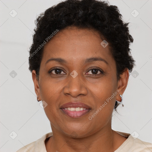 Joyful black adult female with short  brown hair and brown eyes