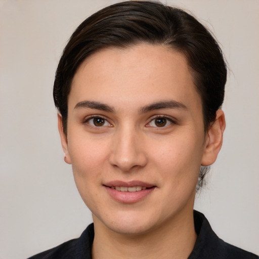 Joyful white young-adult female with medium  brown hair and brown eyes