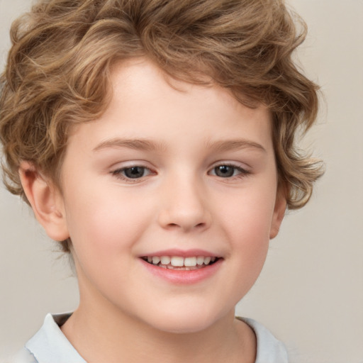 Joyful white child male with short  brown hair and brown eyes