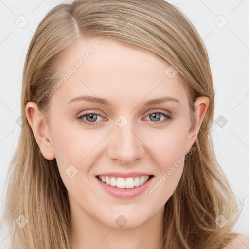 Joyful white young-adult female with long  brown hair and blue eyes