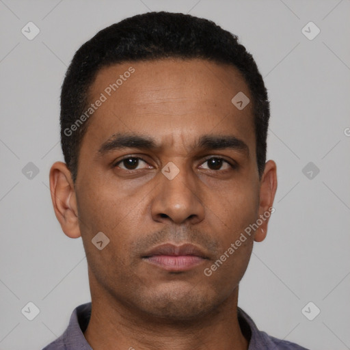 Neutral latino young-adult male with short  brown hair and brown eyes