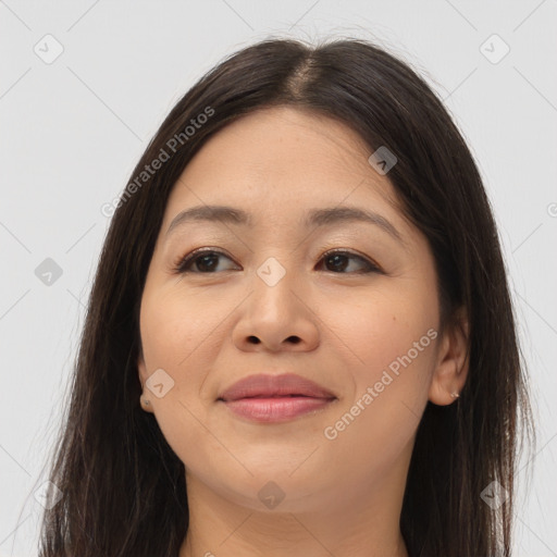 Joyful latino young-adult female with long  brown hair and brown eyes