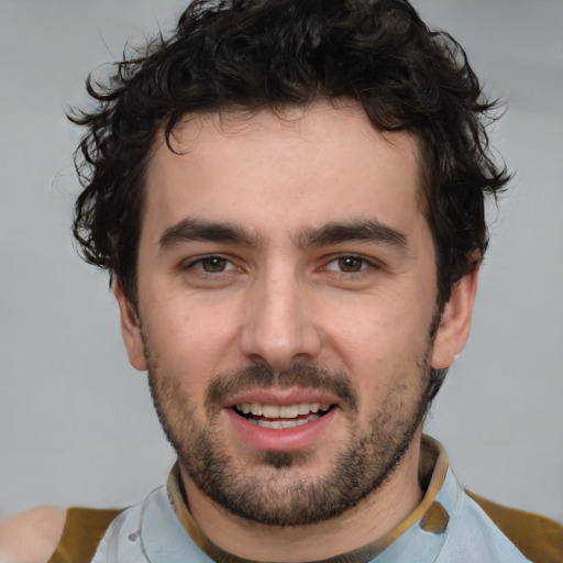 Joyful white young-adult male with short  black hair and brown eyes