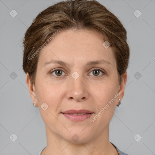 Joyful white adult female with short  brown hair and grey eyes