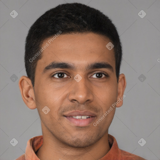 Joyful latino young-adult male with short  brown hair and brown eyes