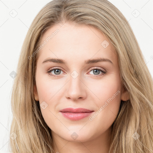 Joyful white young-adult female with long  brown hair and green eyes