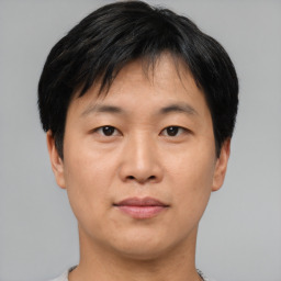 Neutral asian young-adult male with short  black hair and brown eyes