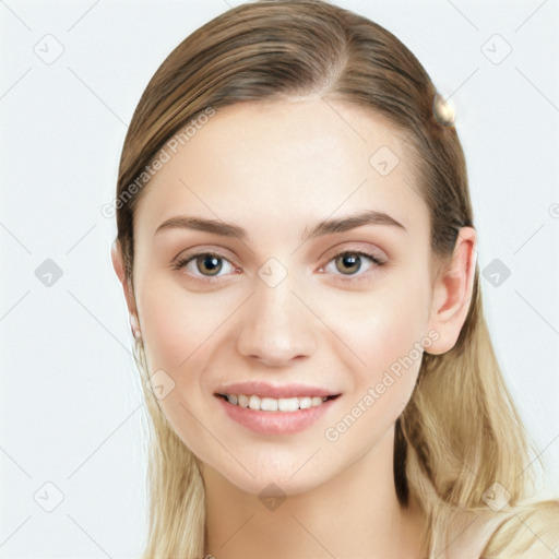 Joyful white young-adult female with long  brown hair and blue eyes