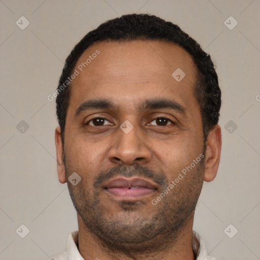 Neutral latino adult male with short  black hair and brown eyes