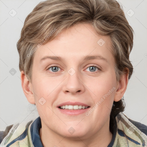 Joyful white young-adult female with medium  brown hair and blue eyes