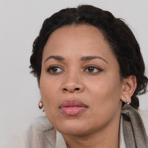 Neutral black adult female with medium  black hair and brown eyes