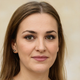 Joyful white young-adult female with long  brown hair and green eyes