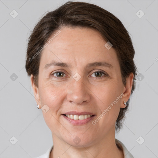 Joyful white adult female with short  brown hair and grey eyes