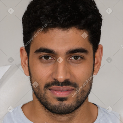 Joyful latino young-adult male with short  black hair and brown eyes